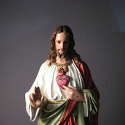 Sacred Heart of Jesus statue in classical Renaissance style, featuring ornate robes and detailed facial expression, standing on a pedestal. Side Angle View
