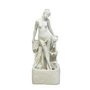 Classical Renaissance-style female statue with draped cloth, standing in a graceful pose on an ornate pedestal.