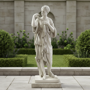 Classical Greek-style female statue in flowing draped robes, standing on a square base with ornate, lifelike detailing. Side Angle